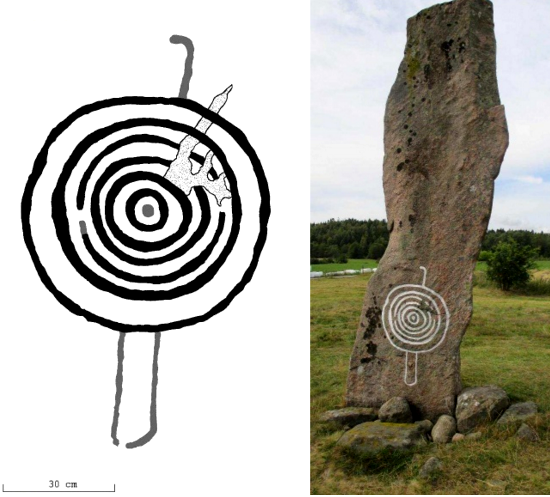 Stele A, south side. The previously known concentric circles representing the sun and/or a shield have now been found to have two legs and a head, that is, we are looking at a person holding a shield and/or the sun.